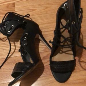 Black strap up heels